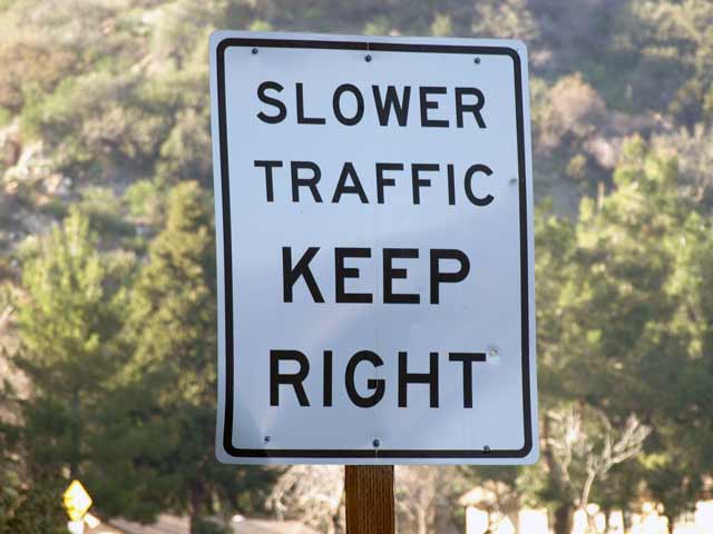 Slower traffic keep to the right street sign.