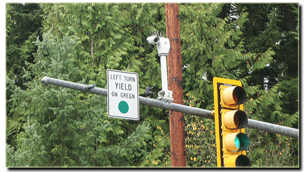 Red light camera at an intersection.